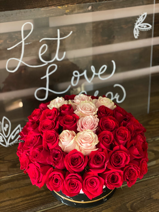 Flower box of roses with a letter